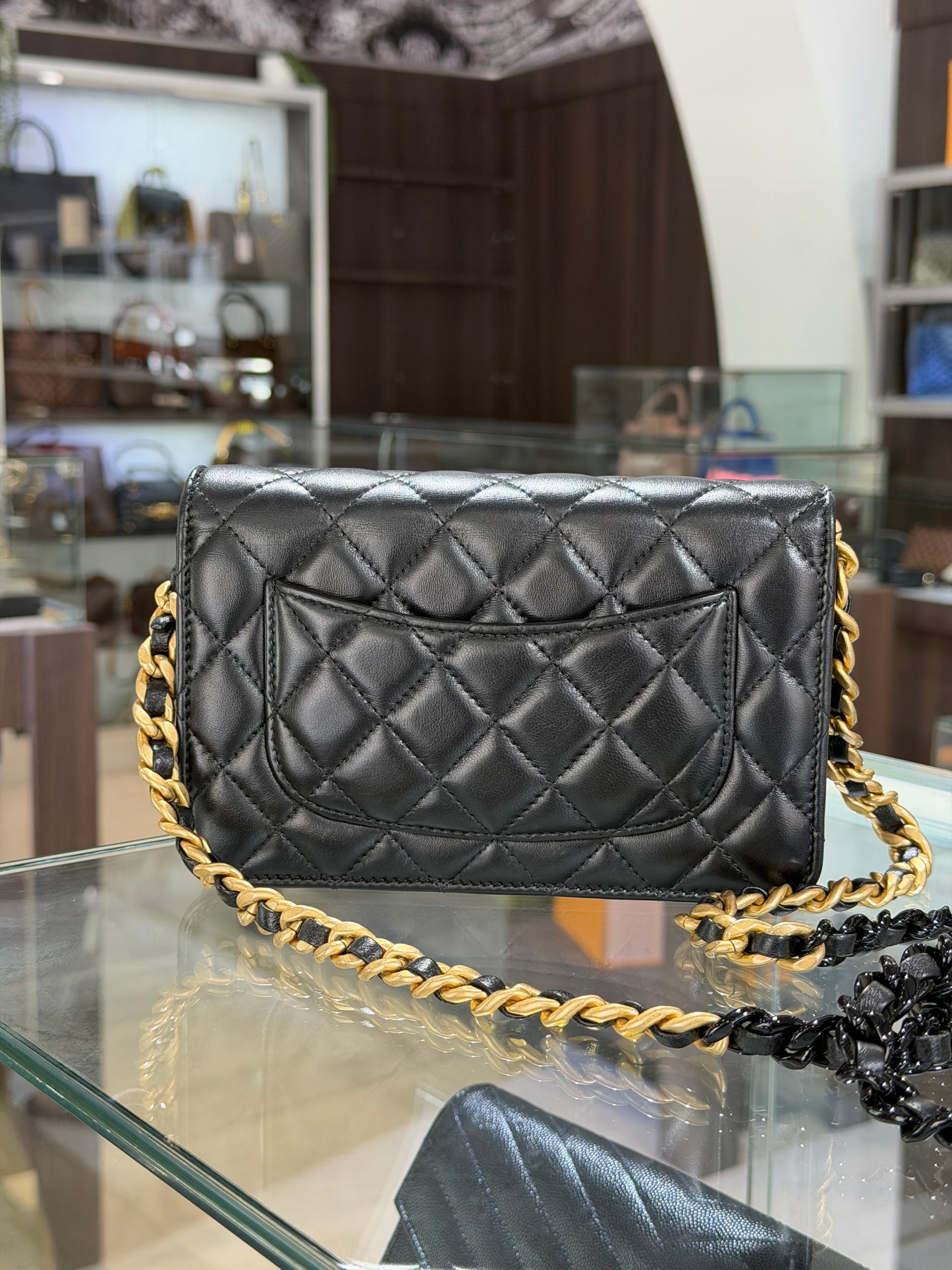 Pre-Owned CC Black Quilted Lambskin WOC Gold Hardware
